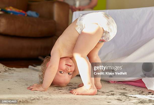 baby wearing pampers on head